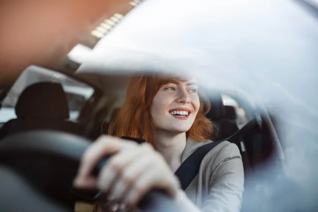 redheaded woman driving 